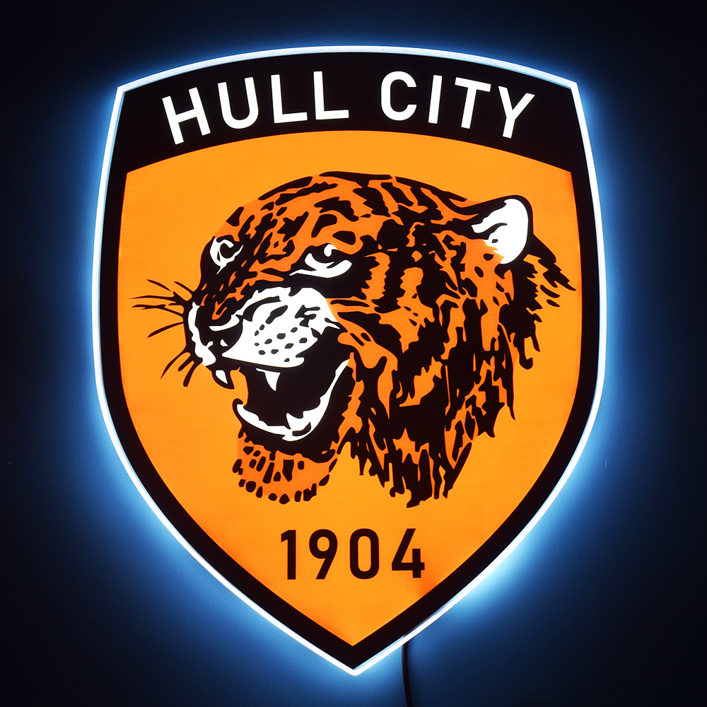 Hull City crest LED light-up panel glowing on a dark wall