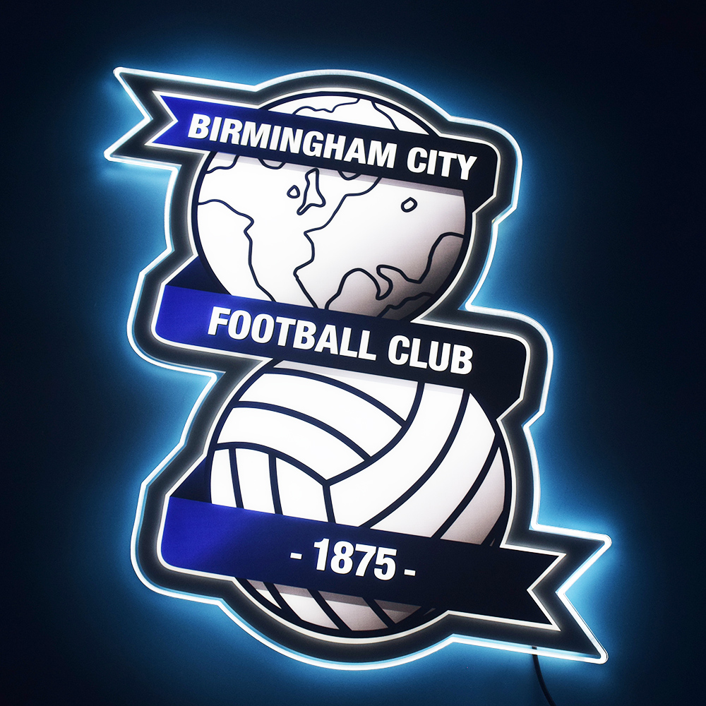 Birmingham City crest LED light-up panel glowing on a dark wall