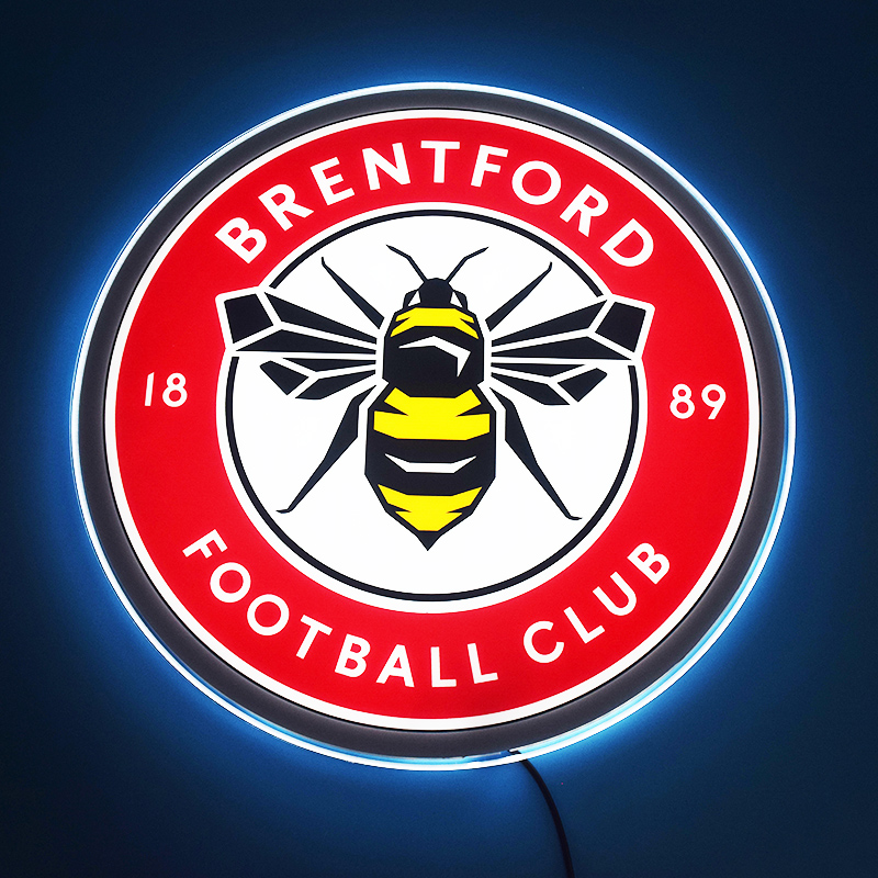Brentford FC LED light-up panel glowing on a dark wall