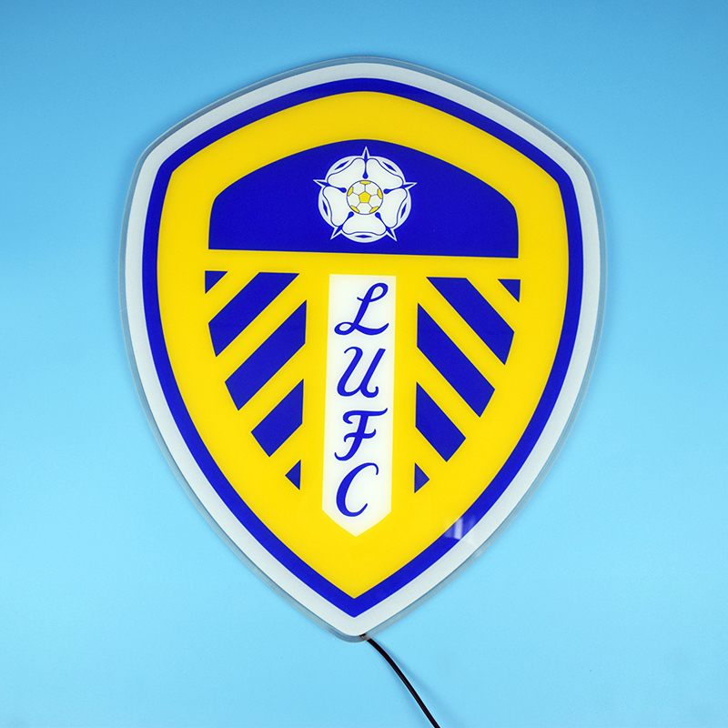 Leeds United LED panel lit up on a blue wall