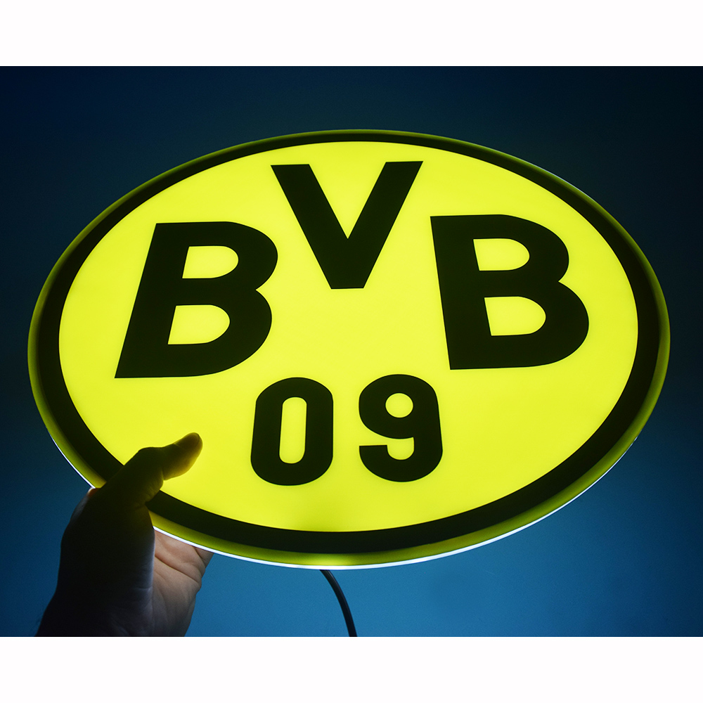 Borussia Dortmund LED panel held up, glowing against a dark background
