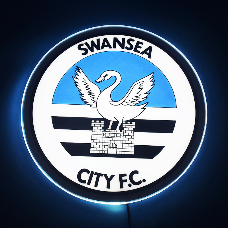 Swansea City LED light-up panel glowing on a dark wall