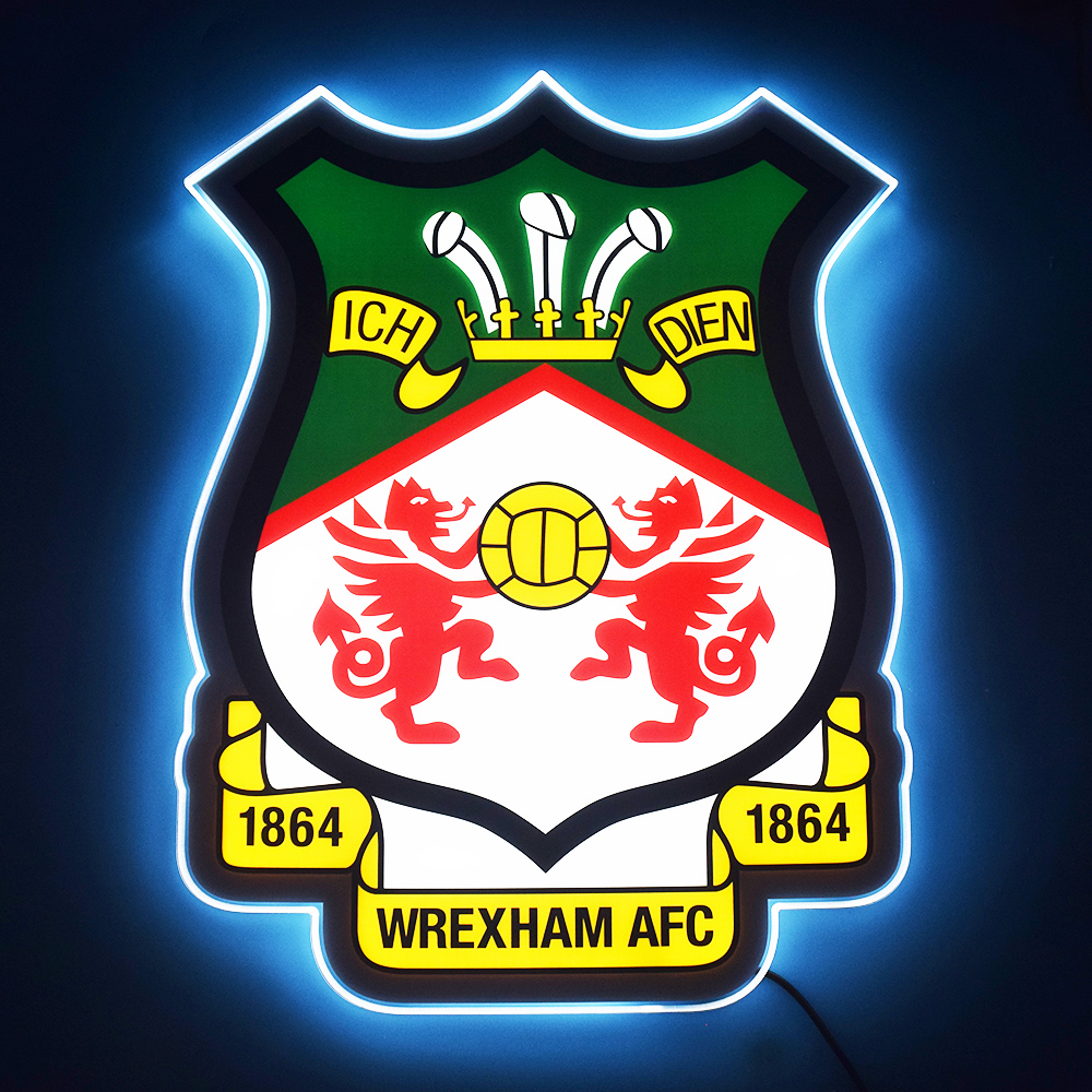 Wrexham AFC crest LED light-up panel glowing on a dark wall