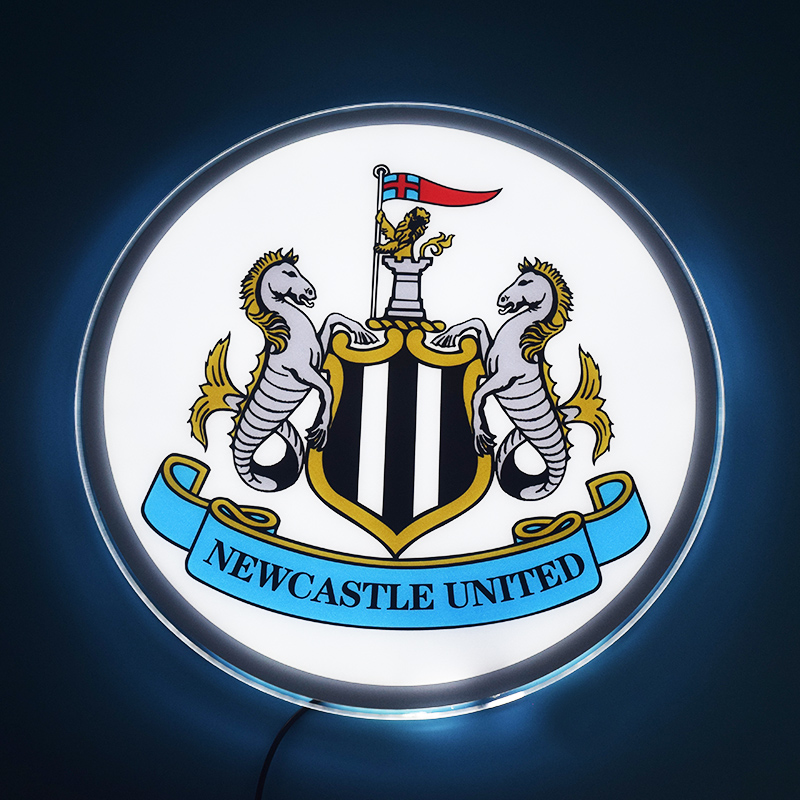 Newcastle United LED light-up panel glowing on a dark wall