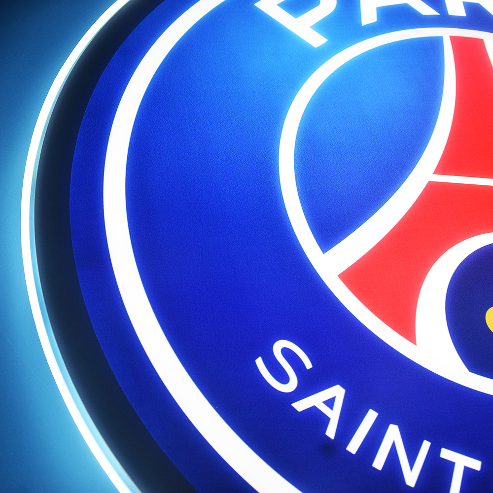 Close-up of the lit Paris Saint-Germain crest detail