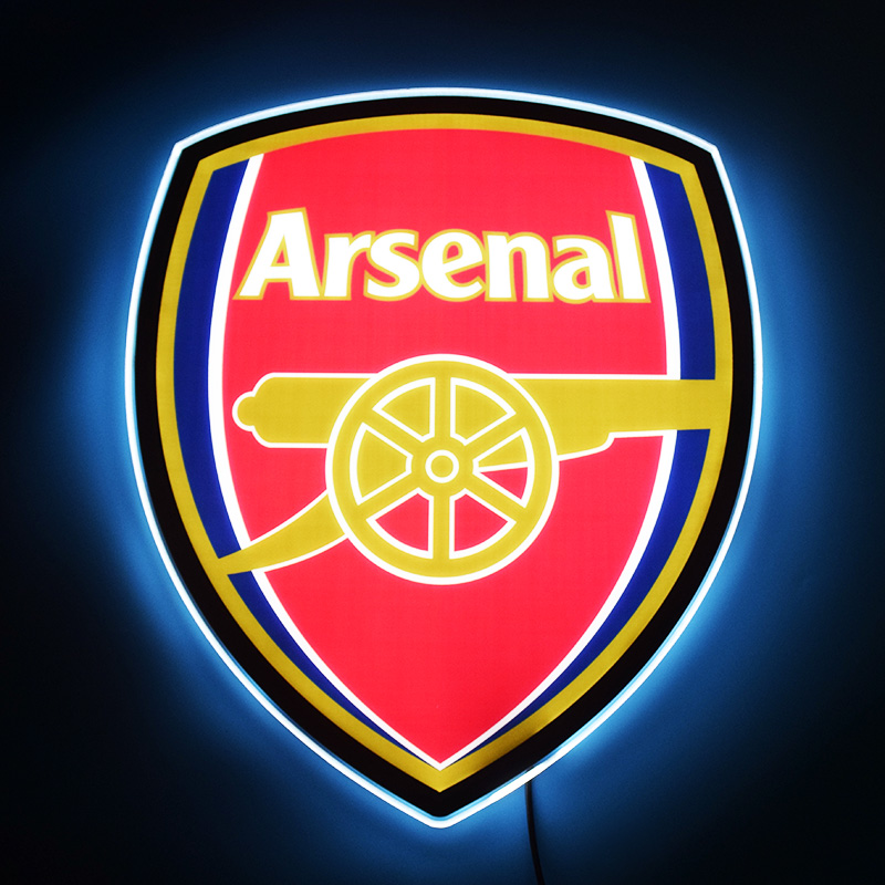 Arsenal crest LED light-up panel glowing on a dark wall