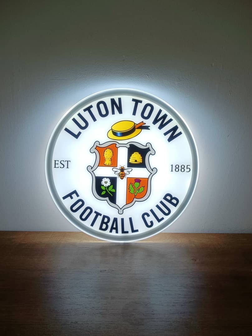 Luton Town FC LED light-up panel glowing on a dark wall