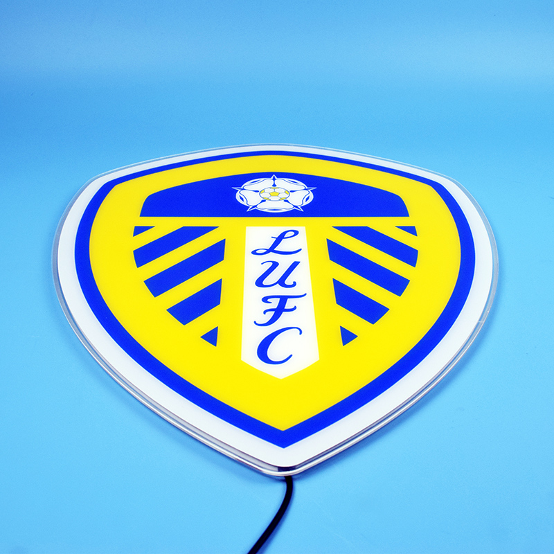 Leeds United crest LED light-up panel glowing against a bright background